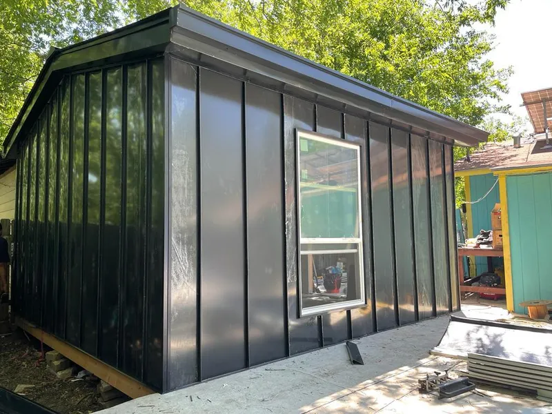 Black standing seam metal wall panels for Roof Inspection in Cooper City